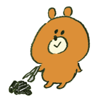 Bear cleaning up barbecue charcoal