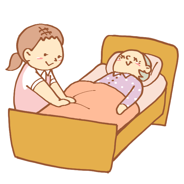 ベッドを整える女性介護士