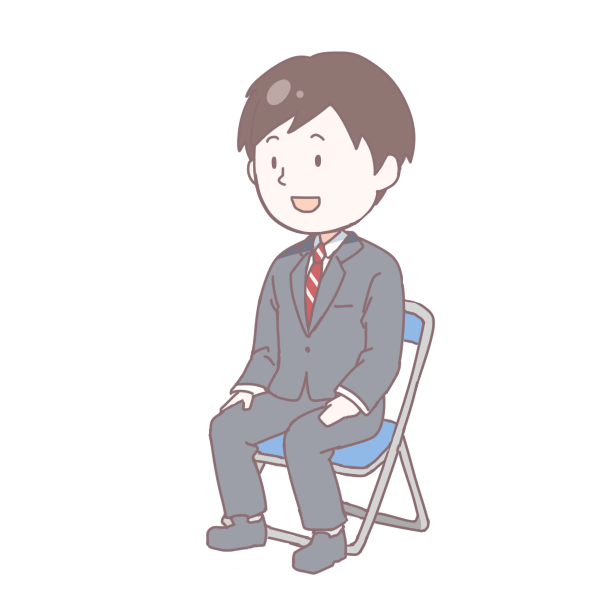 灰色のスーツを着て座っている成人男性