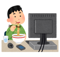 A person who eats rice in front of a computer