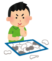 Boy playing jigsaw puzzle