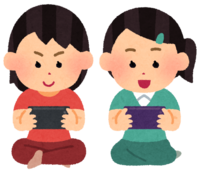 Children (girls) playing games on smartphones
