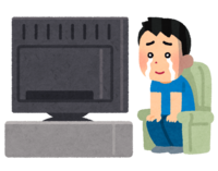 A person watching TV while crying (male)