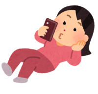 A person (female) who uses a mobile phone while lying down