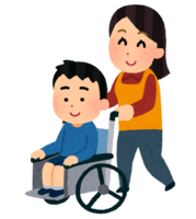 A person pushing a wheelchair on which a boy is riding