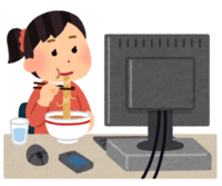 A person who eats rice in front of a computer (female)