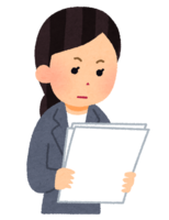 真面目に書類を読んでいる人(女性)