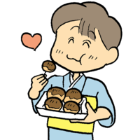 Boy eating takoyaki