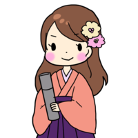 Woman wearing a hakama with a diploma