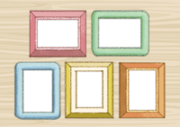 Photo frames lined up on a wooden wall