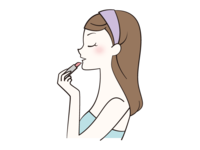 Profile of a woman applying lipstick