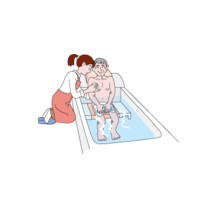 Caregiver taking an old man in the bath