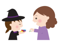 Witch girl getting candy at Halloween