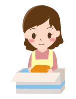 洋服をダンボールにしまう女性