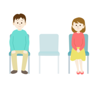 Men and women sitting apart from each other with chairs